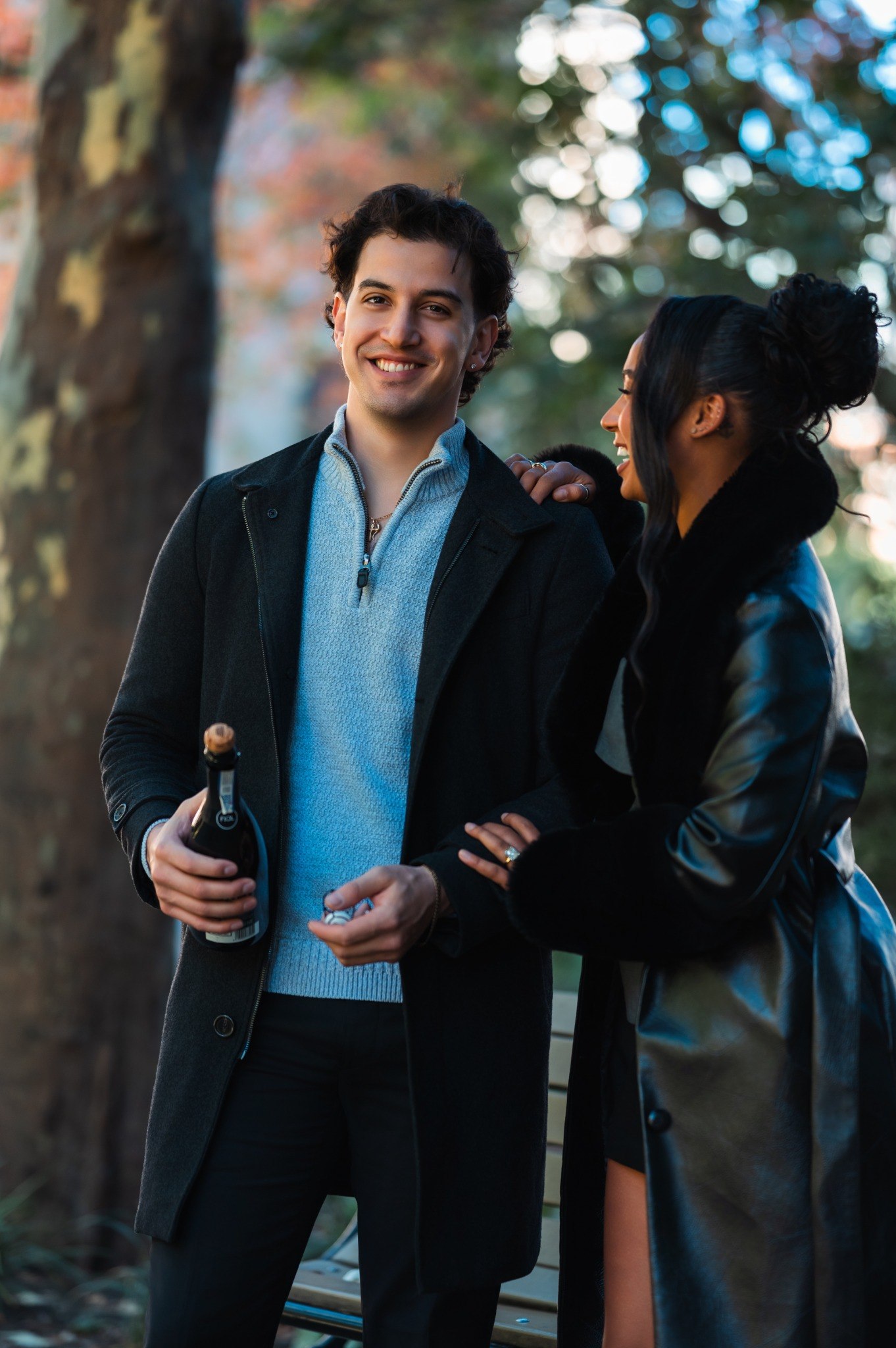 Anthony and Shadean sharing a smile with champagne